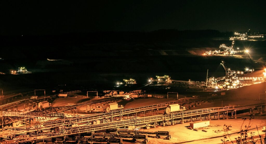 Aerial view of illuminated mining operations at night in Inden, Germany.